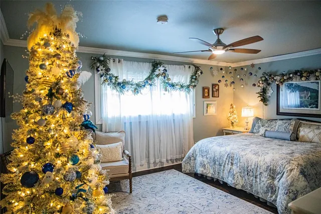 a bedroom with a bed and a chandelier