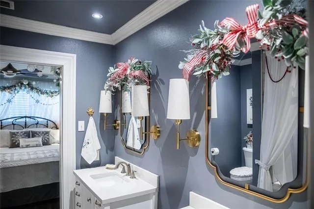 a bathroom with a double vanity sink and a mirror