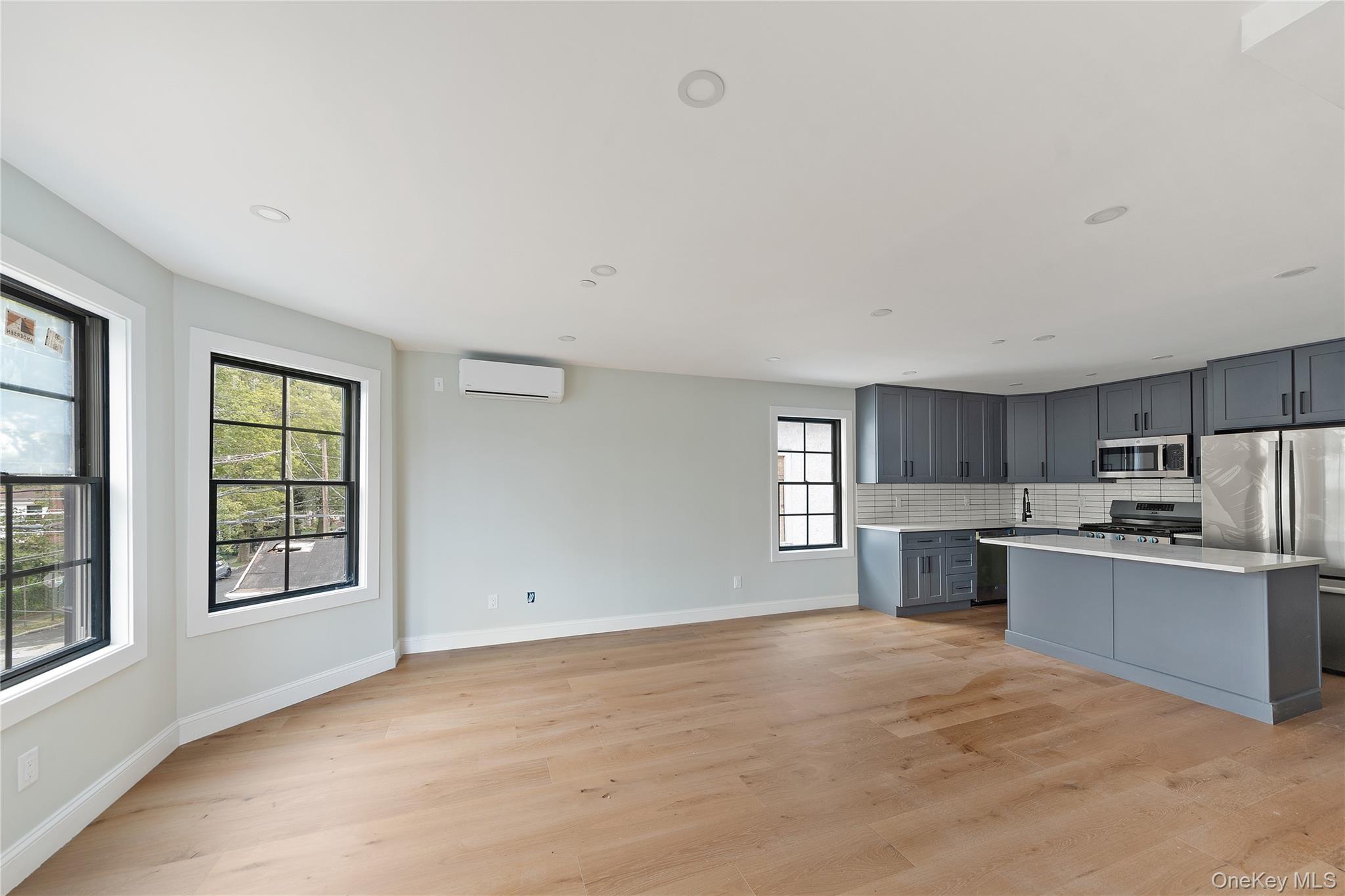 356 South 10th Avenue Mount Vernon, NY 10550 - Photo 11 of 30 a view of kitchen with sink microwave and cabinets