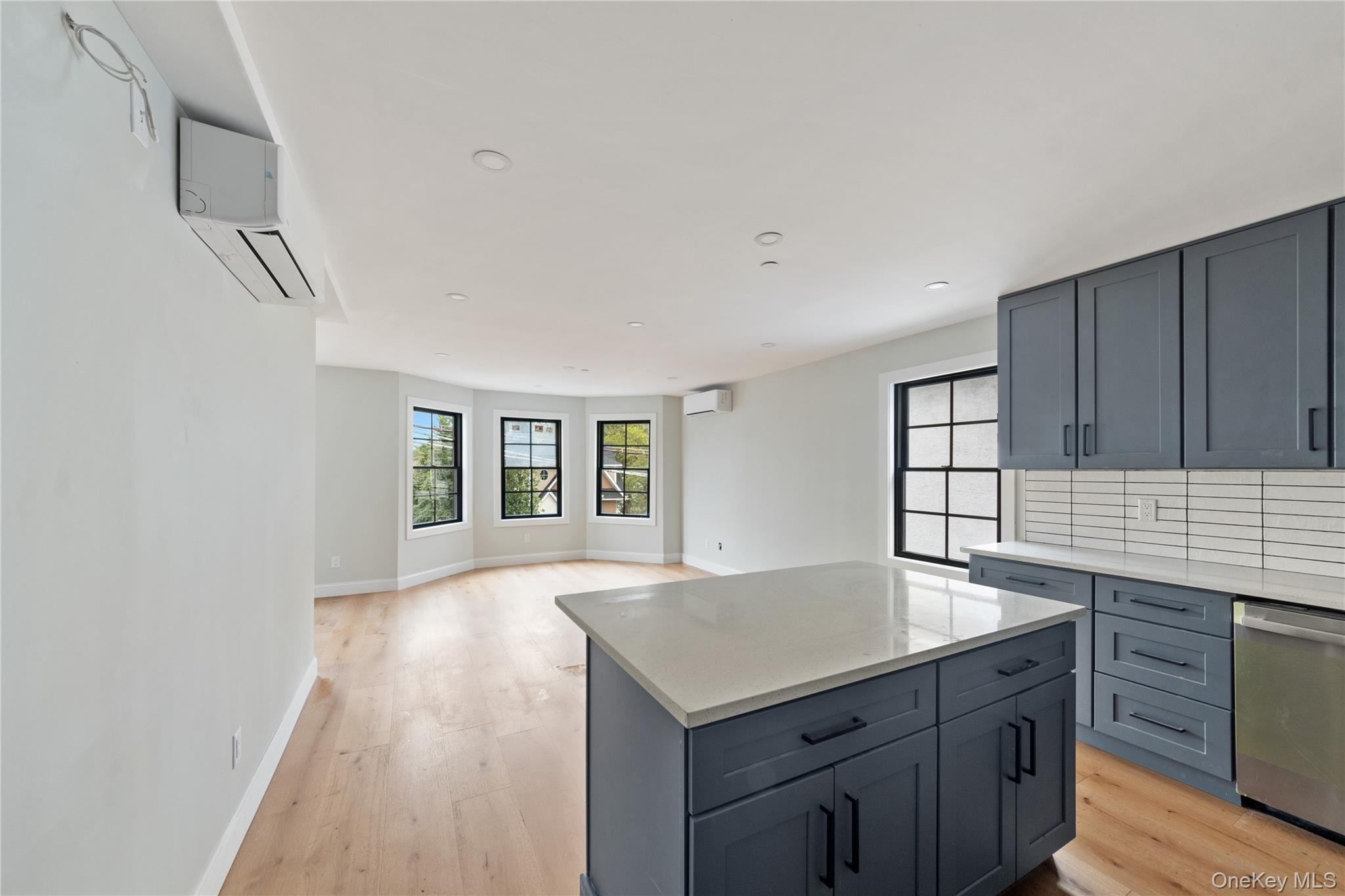 356 South 10th Avenue Mount Vernon, NY 10550 - Photo 12 of 30 a kitchen with granite countertop a sink cabinets and wooden floor