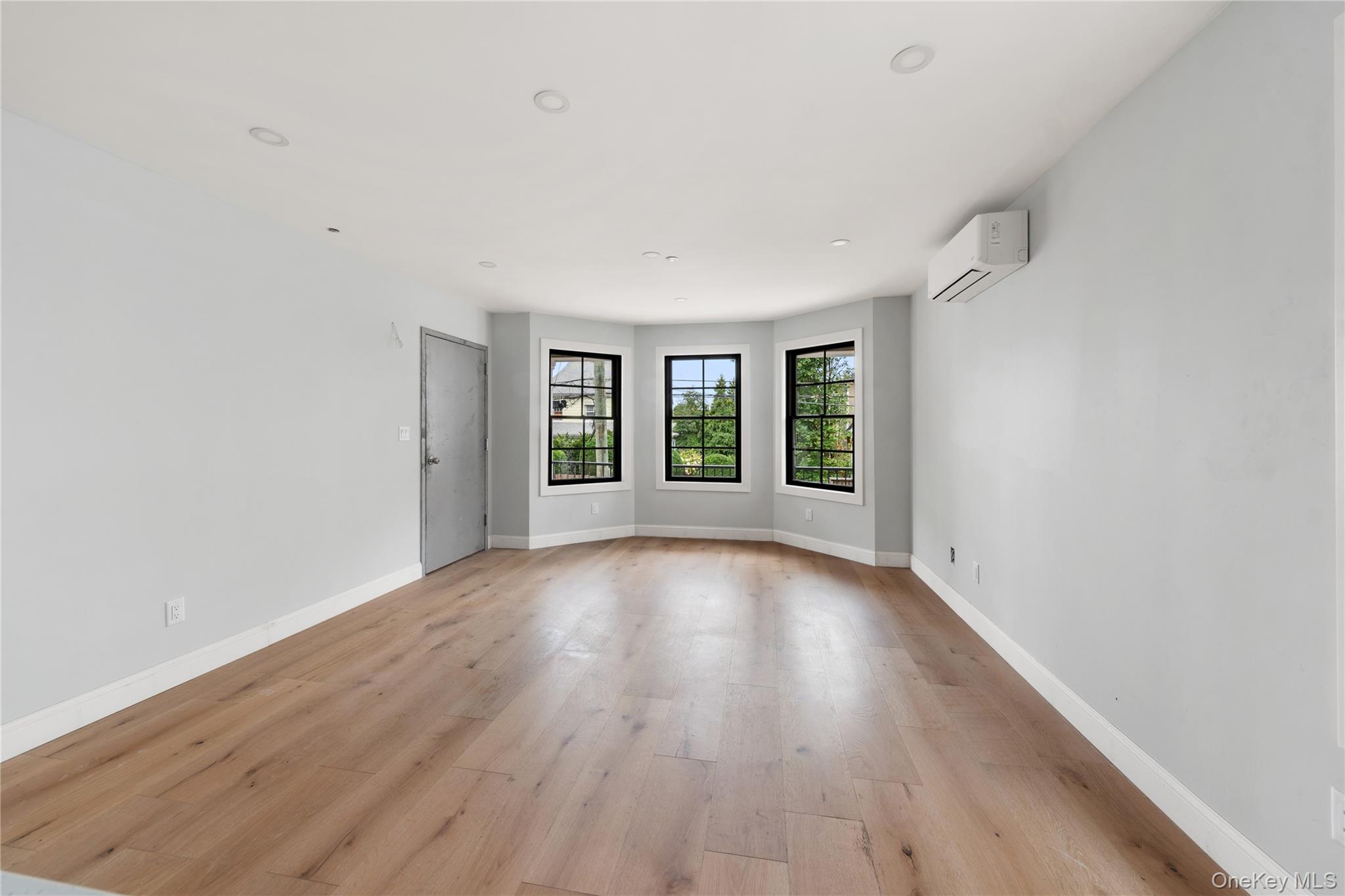 356 South 10th Avenue Mount Vernon, NY 10550 - Photo 26 of 30 wooden floor in an empty room with a window