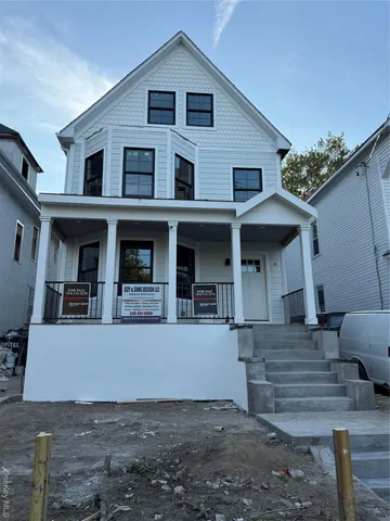 a view of a kitchen with wooden floor