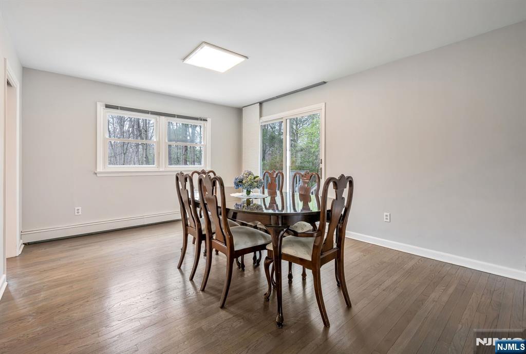 44 Deerfield Terrace Mahwah, NJ 07430 - Photo 11 of 42 a view of a dining room with furniture and wooden floor