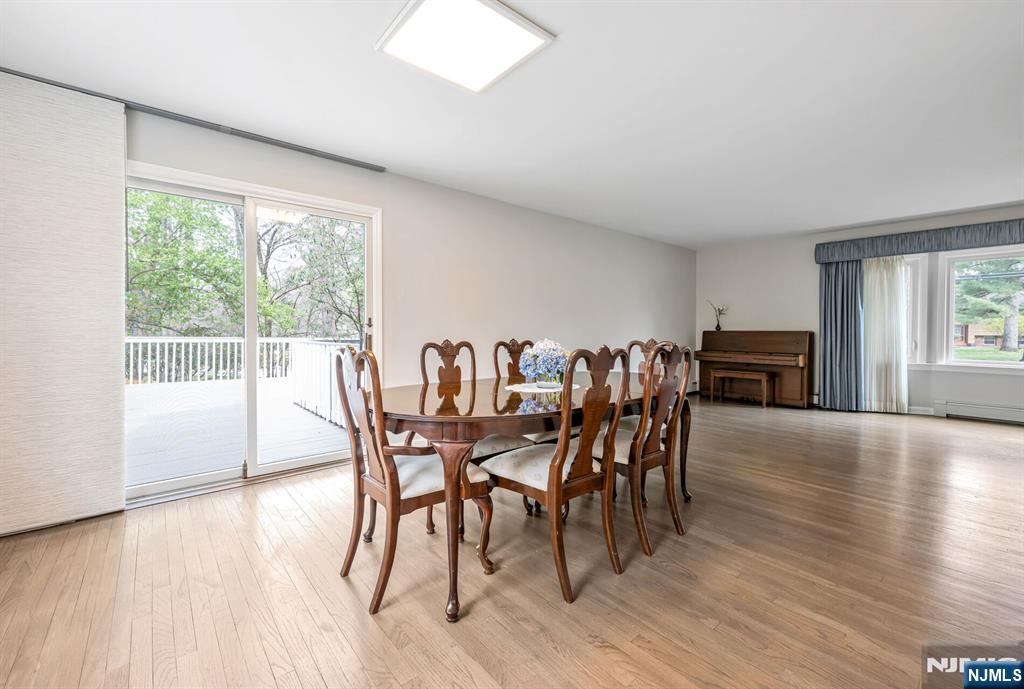44 Deerfield Terrace Mahwah, NJ 07430 - Photo 12 of 42 a dining room with furniture and wooden floor