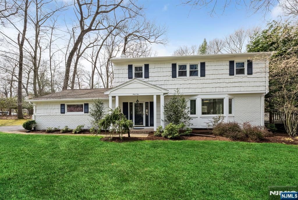 44 Deerfield Terrace Mahwah, NJ 07430 - Photo 2 of 42 a front view of a house with a yard and trees