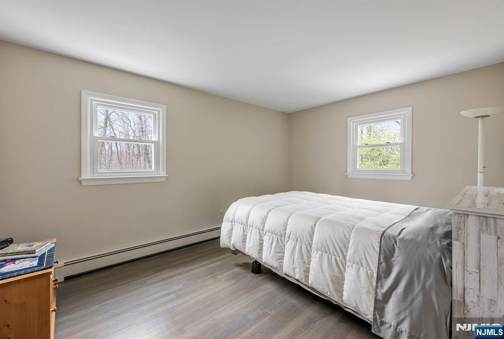 44 Deerfield Terrace Mahwah, NJ 07430 - Photo 30 of 42 a bedroom with a bed and a window
