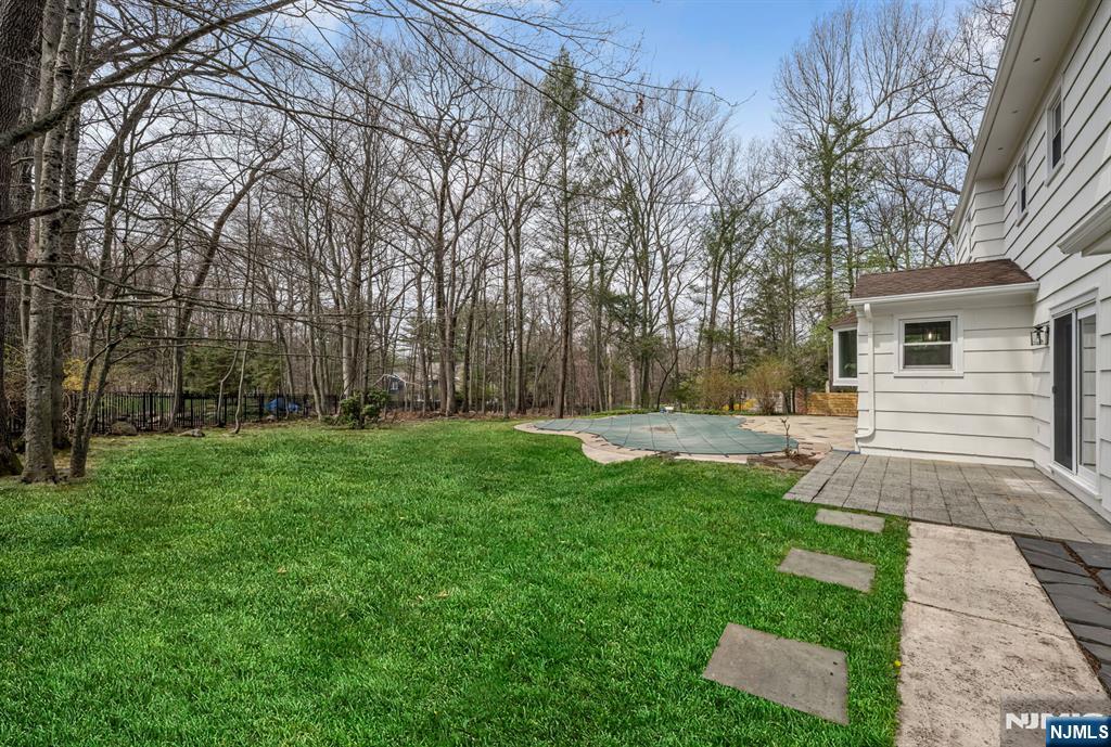 44 Deerfield Terrace Mahwah, NJ 07430 - Photo 36 of 42 a view of a backyard with a garden