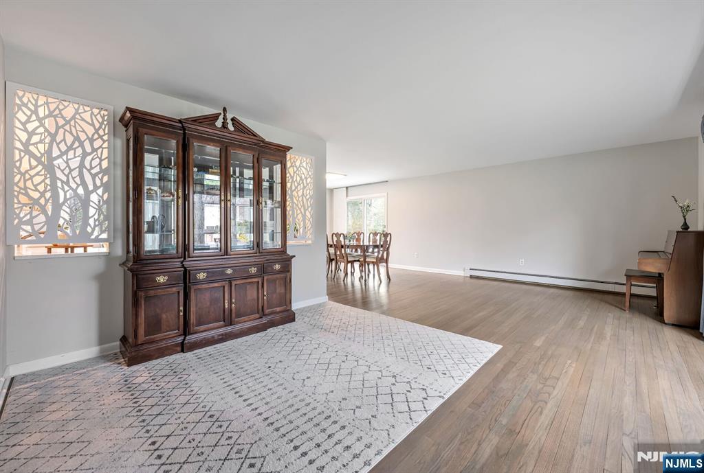 44 Deerfield Terrace Mahwah, NJ 07430 - Photo 9 of 42 a living room with furniture and a wooden floor