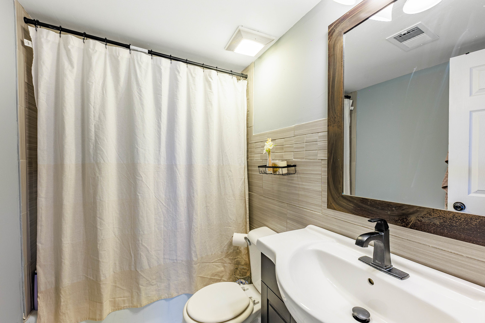 11036 Kilpatrick Avenue, Unit 3SW Oak Lawn, IL 60453 - Photo 11 of 19 a bathroom with a sink and a mirror