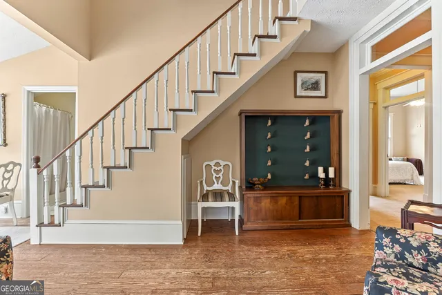 a bed room with a bed and a chandelier