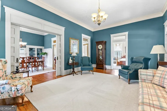 a view of a dining room with furniture window and wooden floor