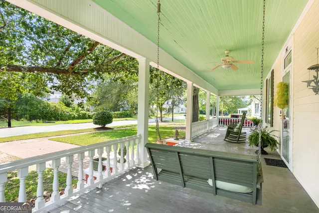 a living room with furniture a window and a fireplace