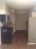 a kitchen with a refrigerator in it