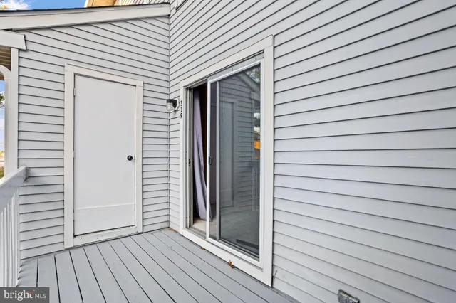 a view of wooden door and windows