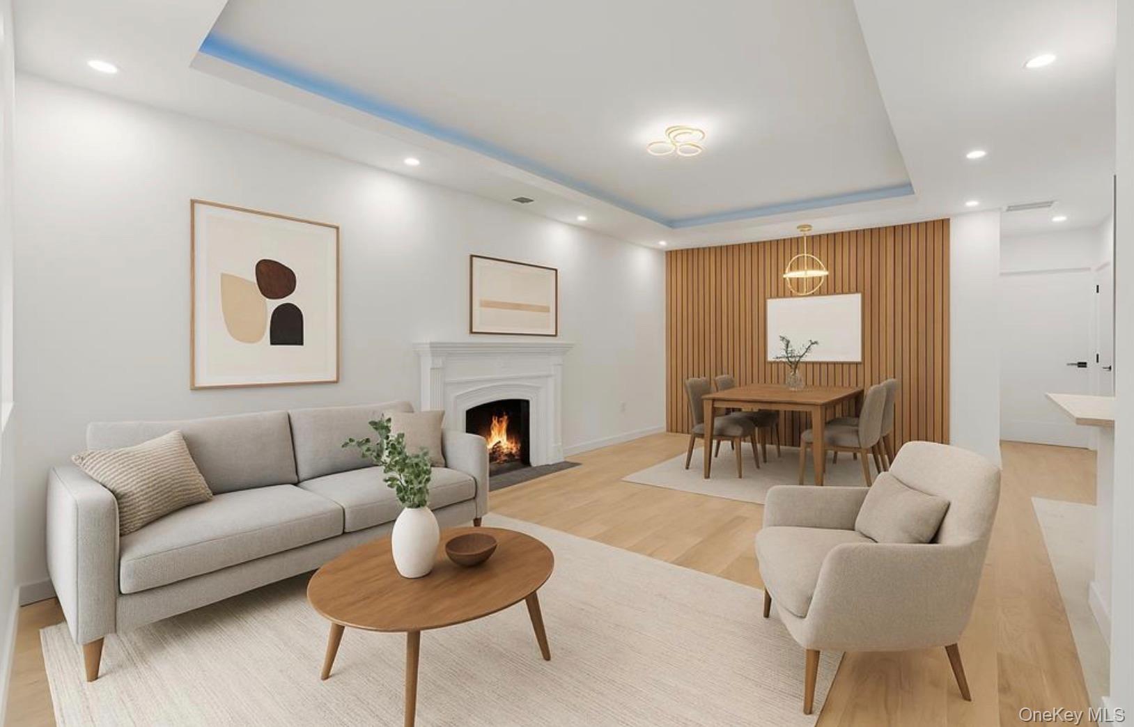 752 Lenox Road Brooklyn, NY 11203 - Photo 2 of 14 Living room featuring a raised ceiling, light wood finished floors, a fireplace with flush hearth, and recessed lighting