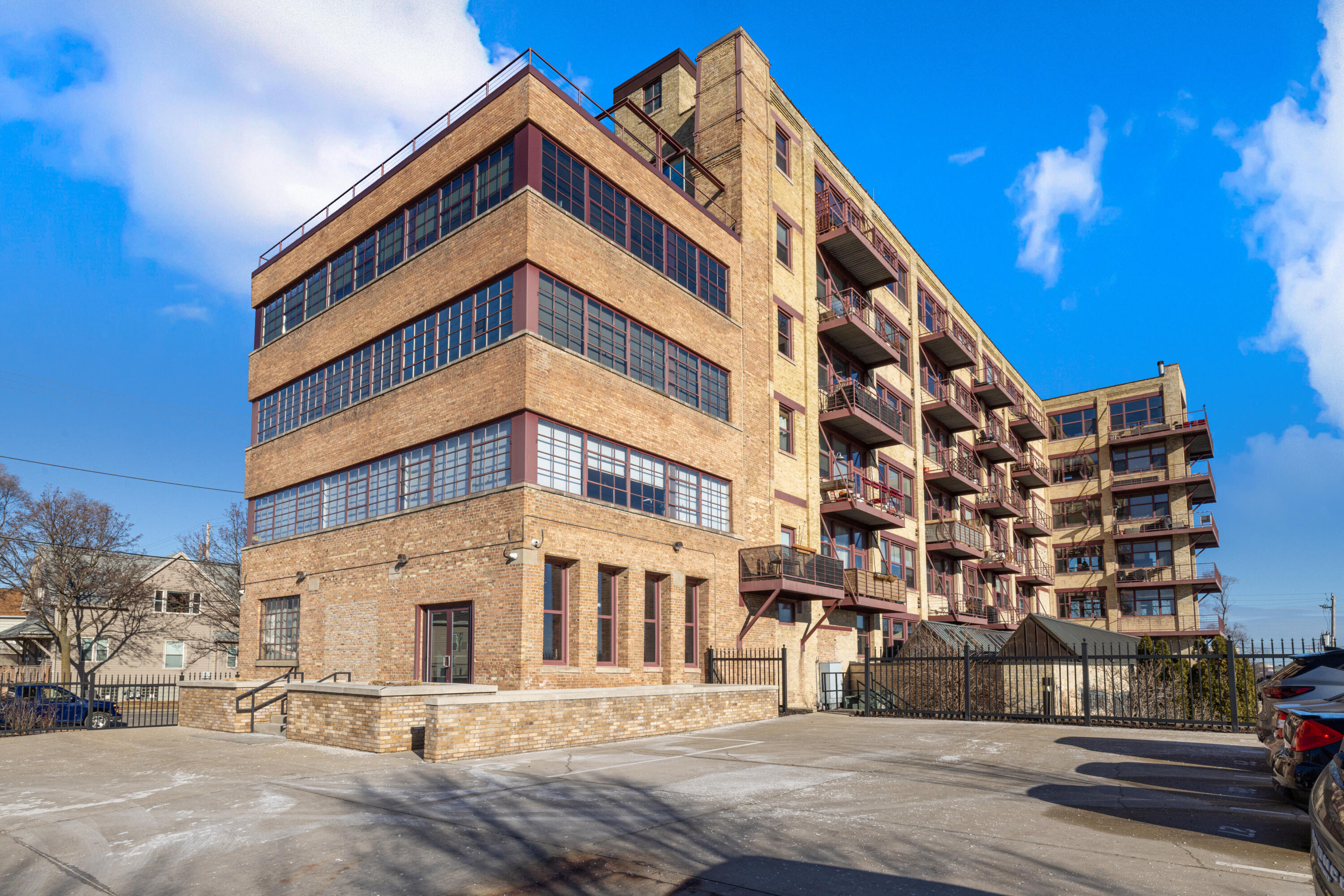 215 West Maple Street, Unit 105 Milwaukee, WI 53204 - Photo 23 of 33 Exterior building view from parking lot