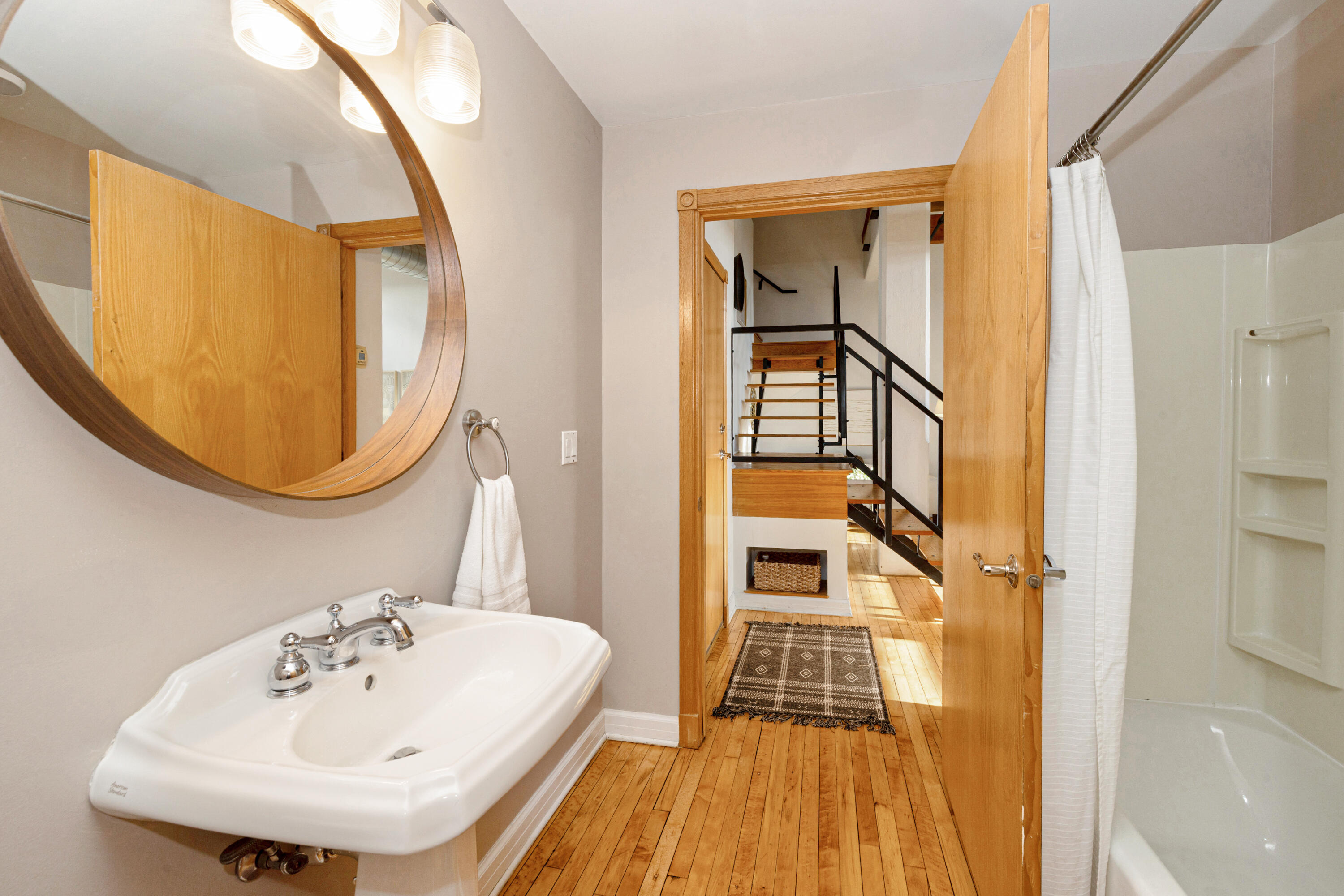 215 West Maple Street, Unit 105 Milwaukee, WI 53204 - Photo 5 of 33 Full bath off of entrance to condo