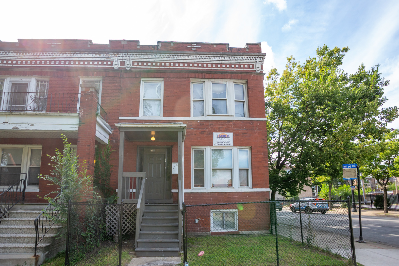 a front view of a building with garden