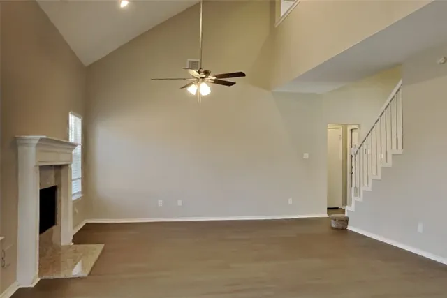 a view of an empty room with a fireplace