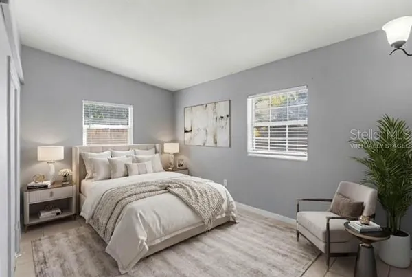 a bedroom with a bed and window