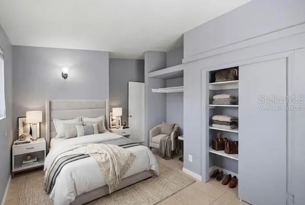 a bedroom with a bed and a closet