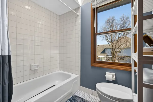 a bathroom with a toilet a sink and bathtub