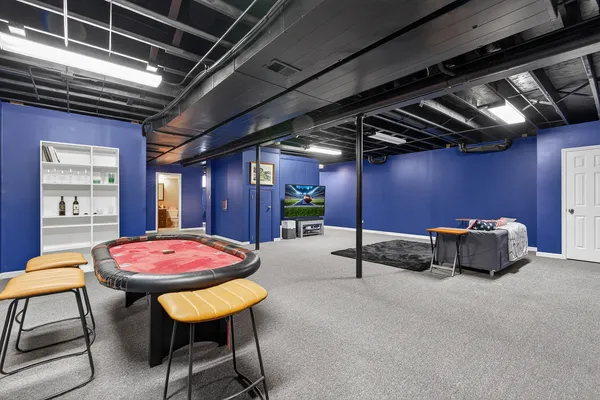 a patio with table and chairs