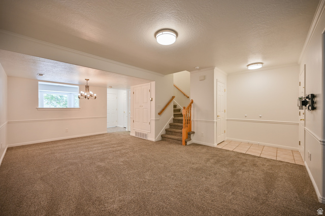 1799 West 1110th Street North Provo, UT 84604 - Photo 5 of 24 Spacious carpeted living area with overhead lighting and wainscoting details