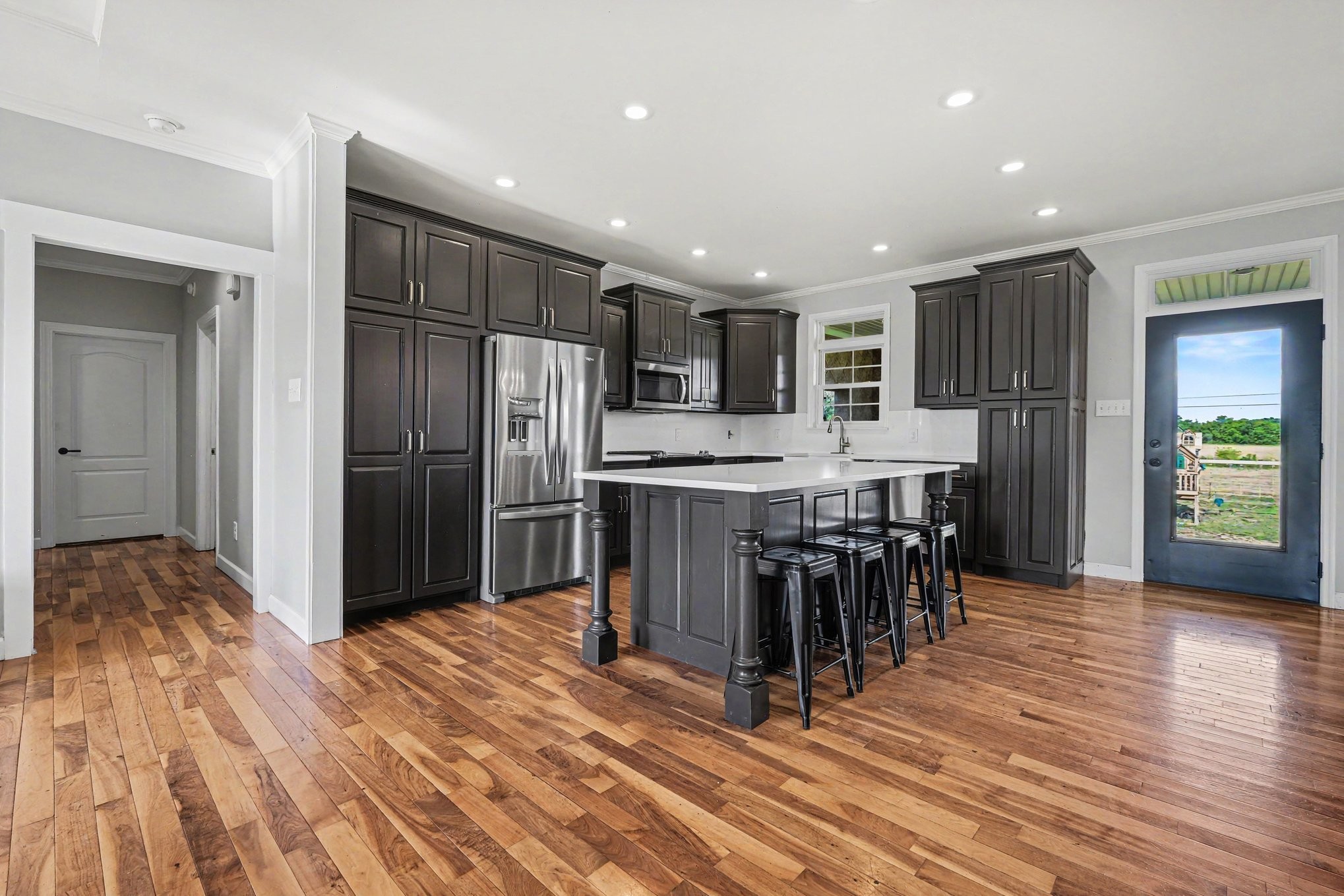 2829 Anes Station Road Lewisburg, TN 37091 - Photo 16 of 43 a kitchen with stainless steel appliances kitchen island granite countertop a refrigerator and a sink