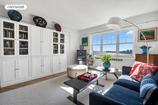 a living room with furniture and a window