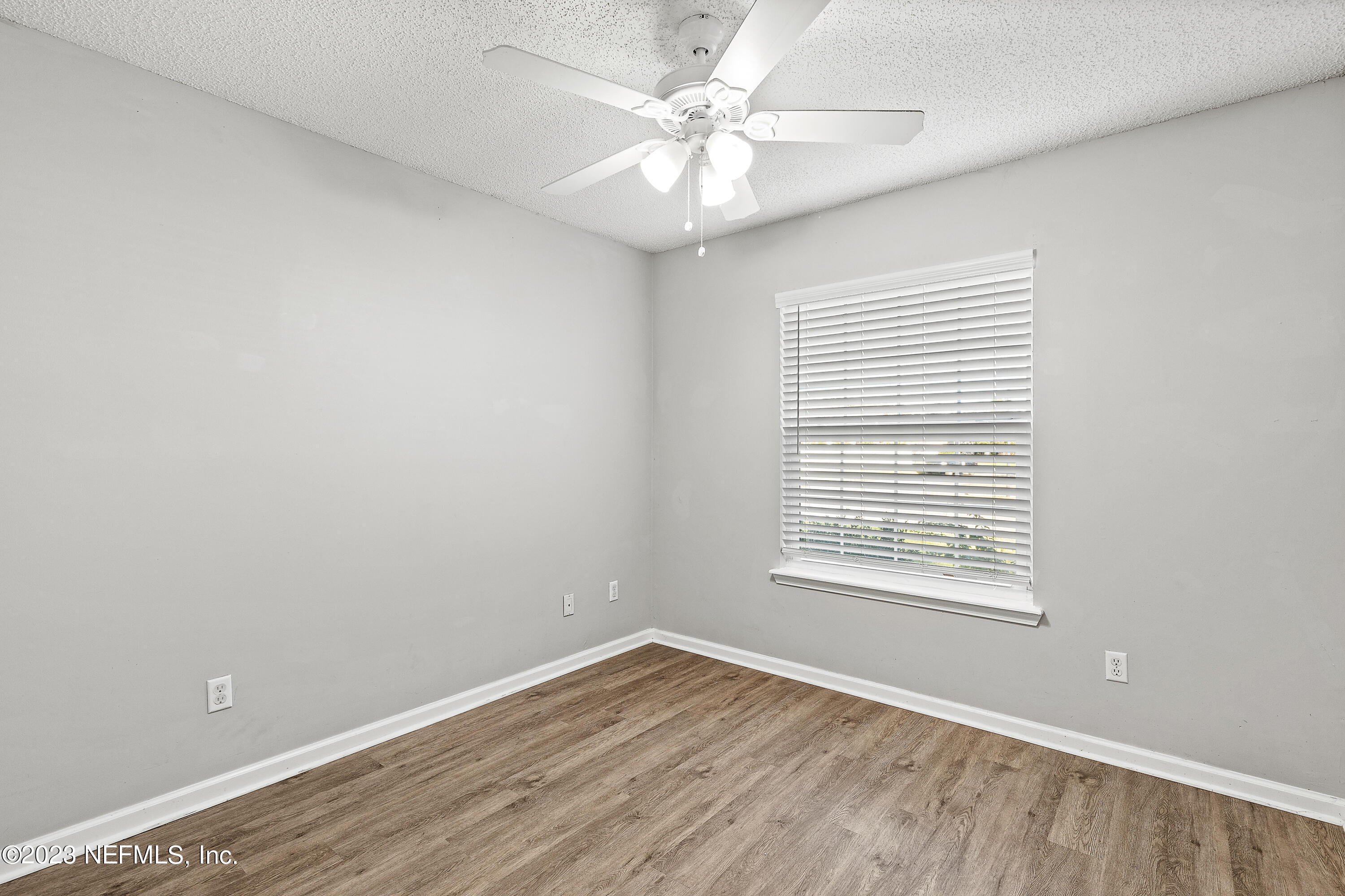 13240 Pacemaker Drive Jacksonville, FL 32225 - Photo 14 of 21 an empty room with a window and a fan