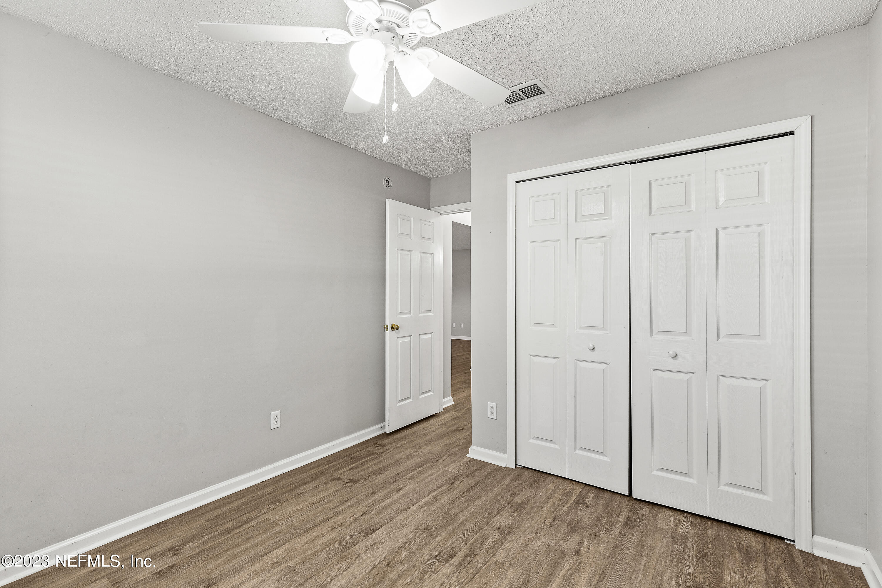 13240 Pacemaker Drive Jacksonville, FL 32225 - Photo 15 of 21 a view of an empty room with wooden floor