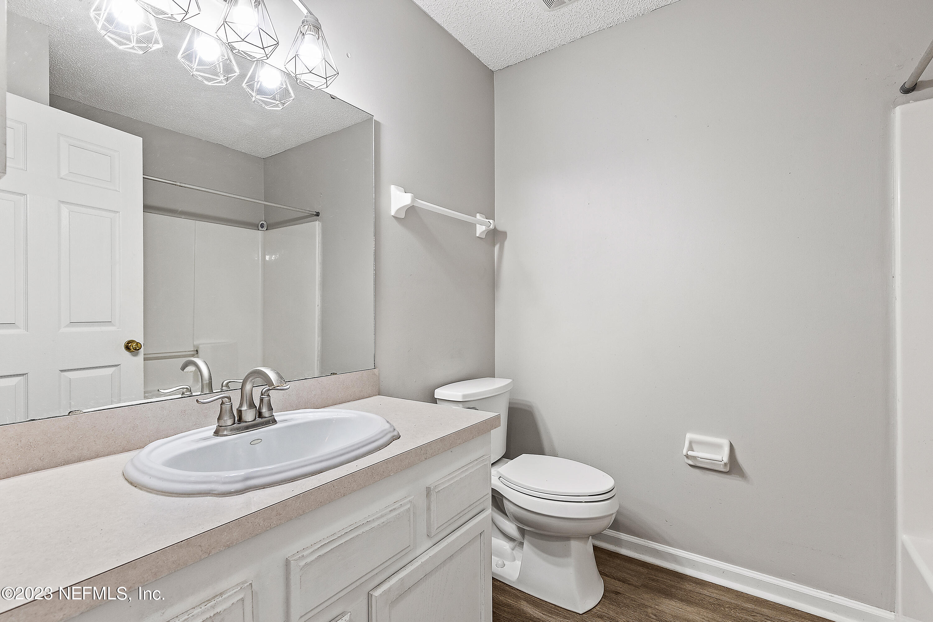 13240 Pacemaker Drive Jacksonville, FL 32225 - Photo 16 of 21 a bathroom with a toilet a sink and mirror