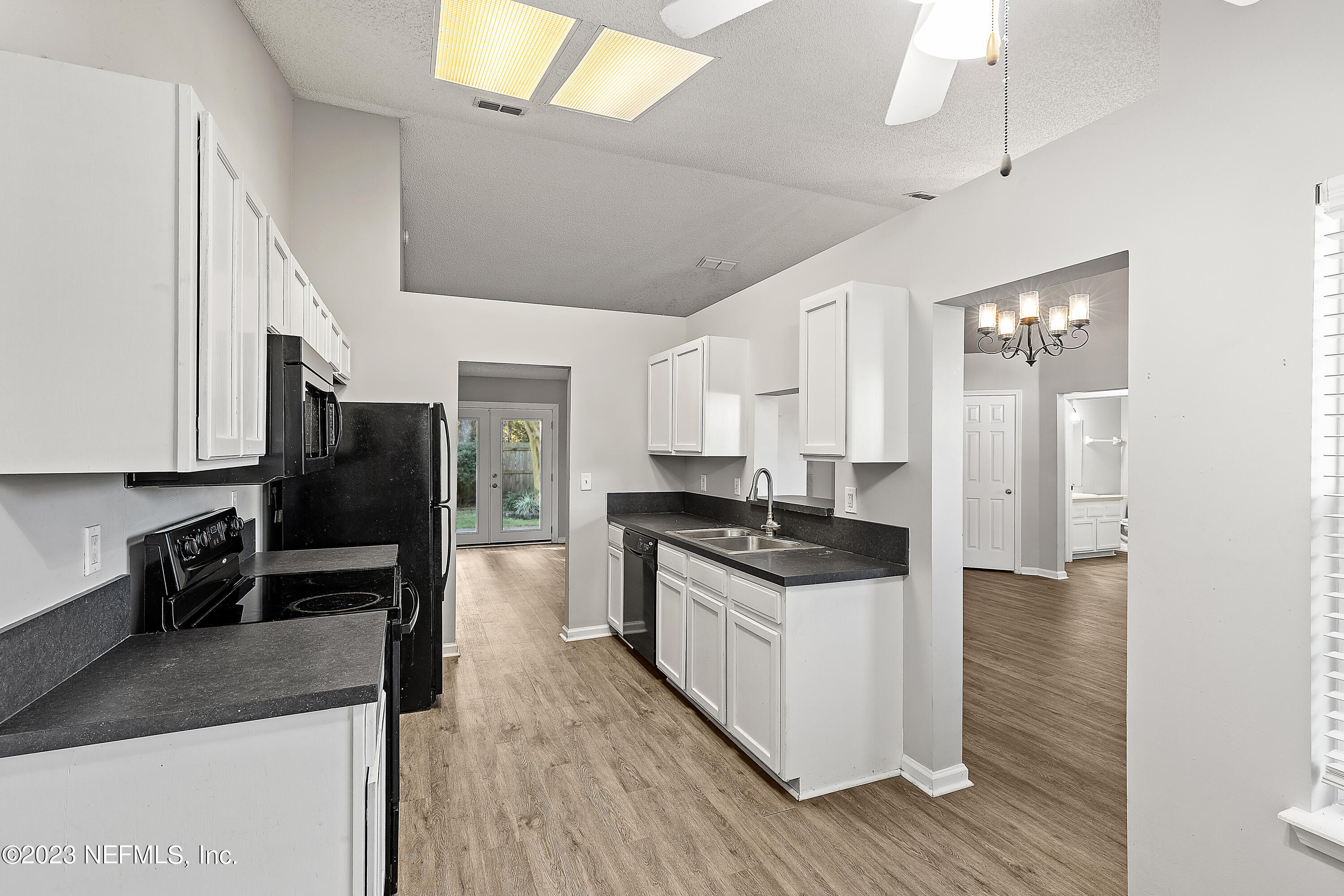 13240 Pacemaker Drive Jacksonville, FL 32225 - Photo 6 of 21 a kitchen with stainless steel appliances granite countertop a stove and a refrigerator