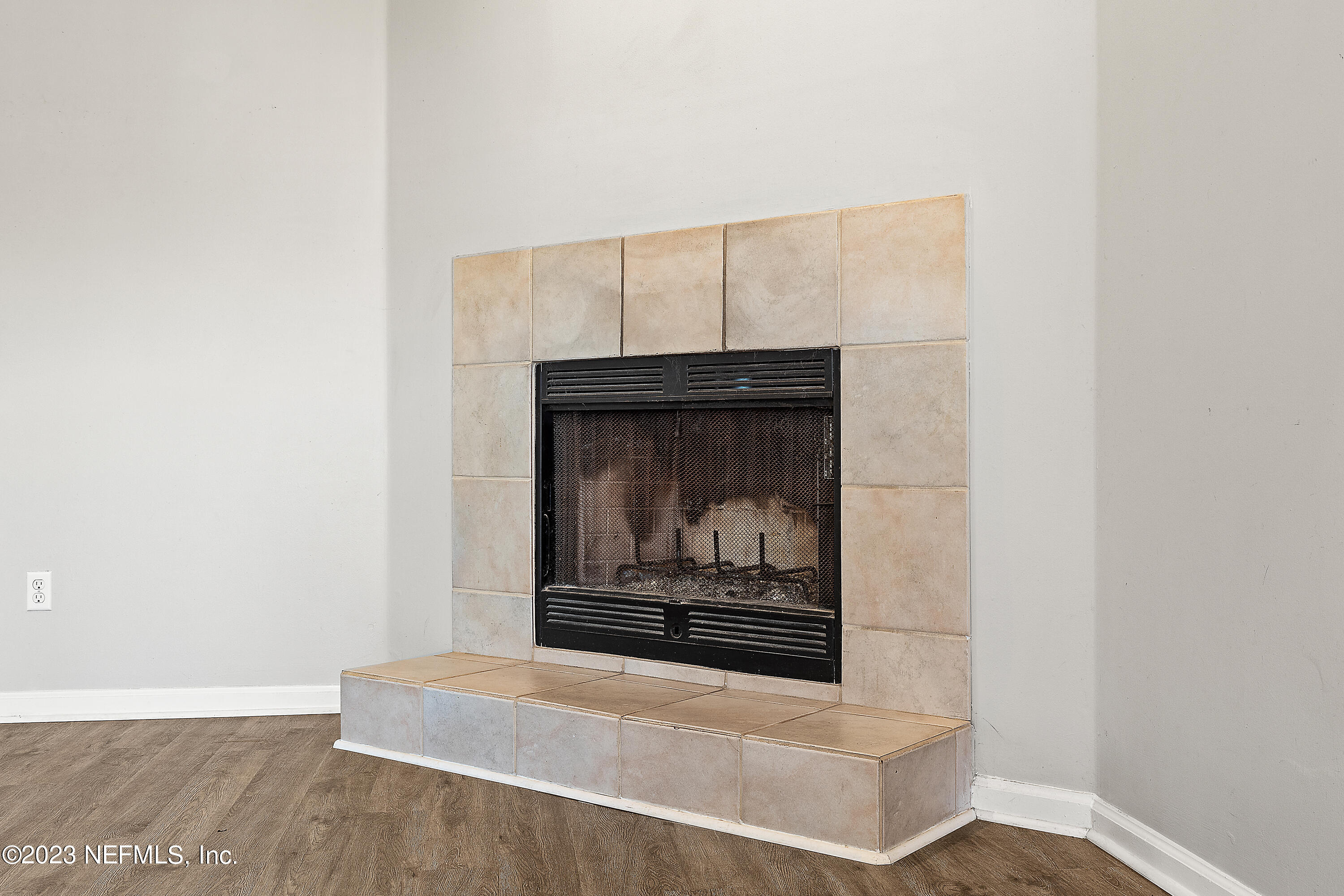 13240 Pacemaker Drive Jacksonville, FL 32225 - Photo 10 of 21 a view of fireplace with wooden floor