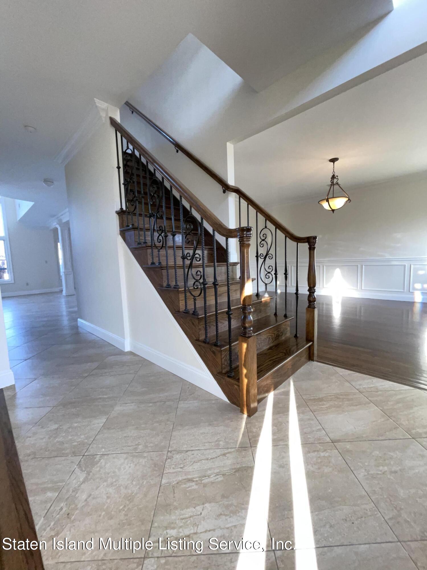 67 Hanover Avenue Staten Island, NY 10309 - Photo 11 of 22 Staircase with wrought Iron Railing