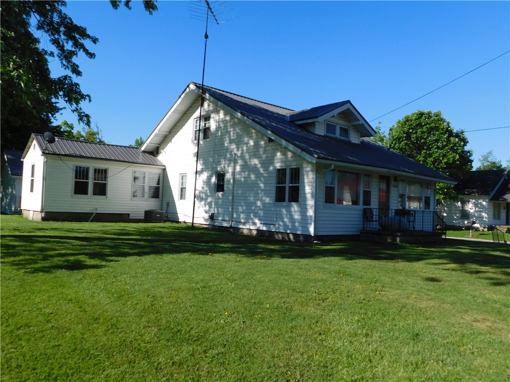 1301 East Main Street Casey, IL 62420 - Photo 6 of 14 a front view of a house with a garden