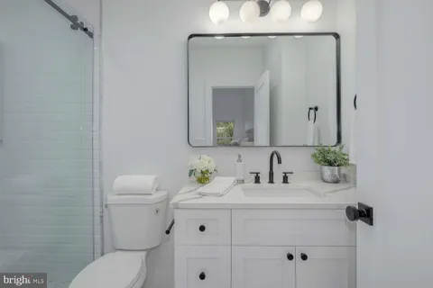 a bedroom with a bed and a chair