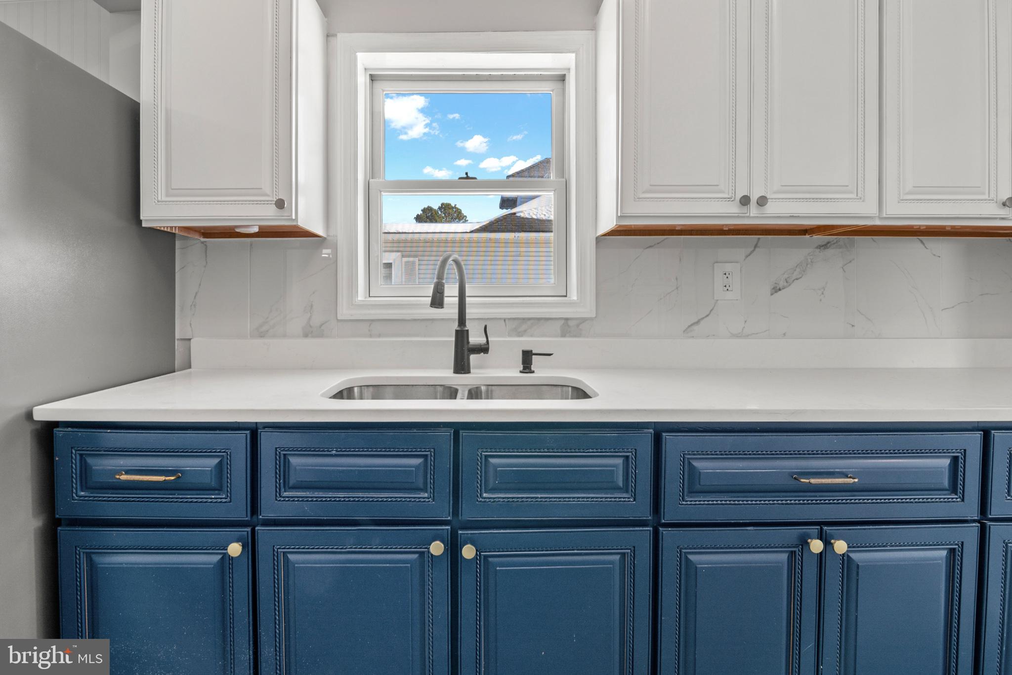 315 Riverside Drive Essex, MD 21221 - Photo 15 of 33 a sink with cabinets and window