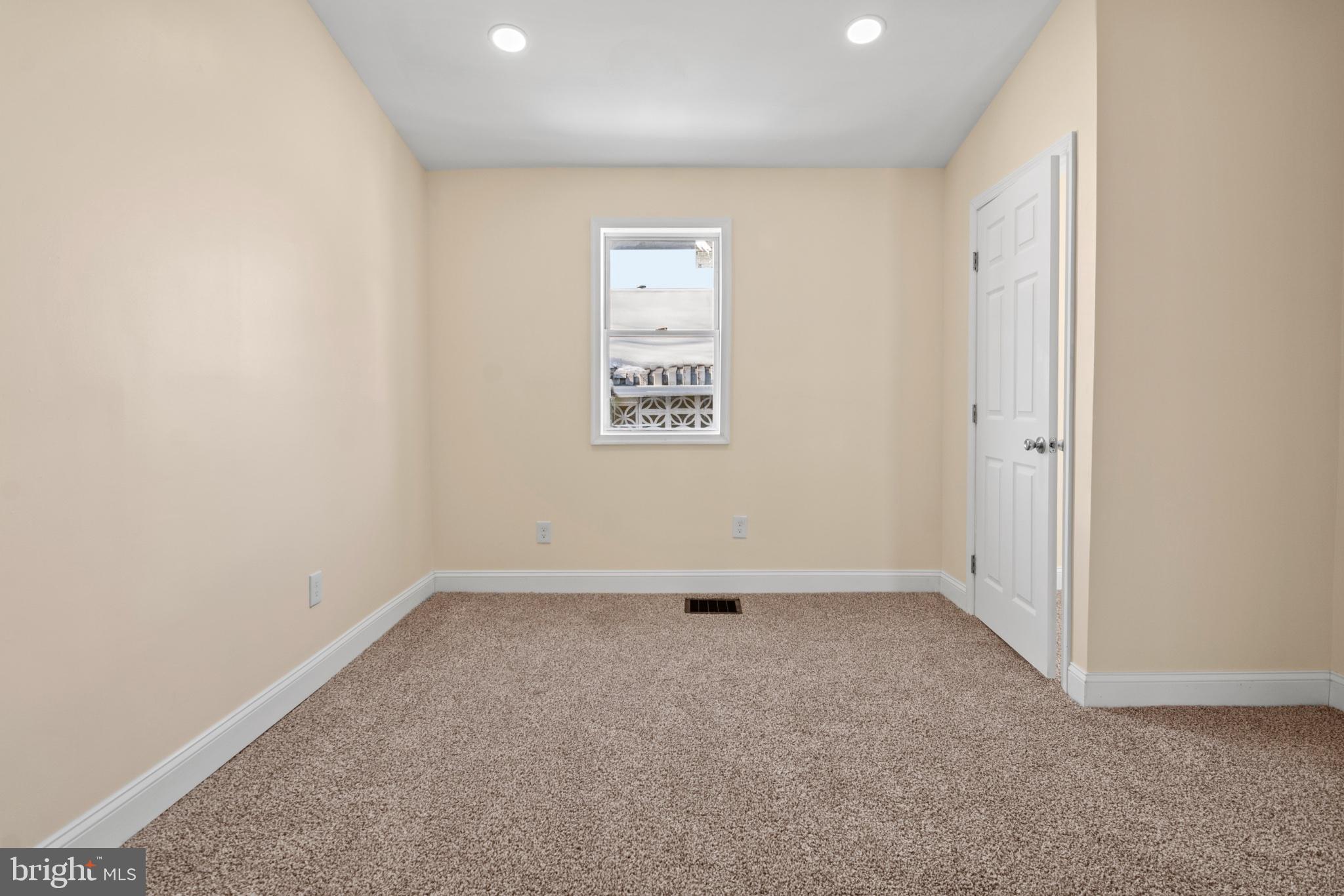 315 Riverside Drive Essex, MD 21221 - Photo 22 of 33 an empty room with a hallway