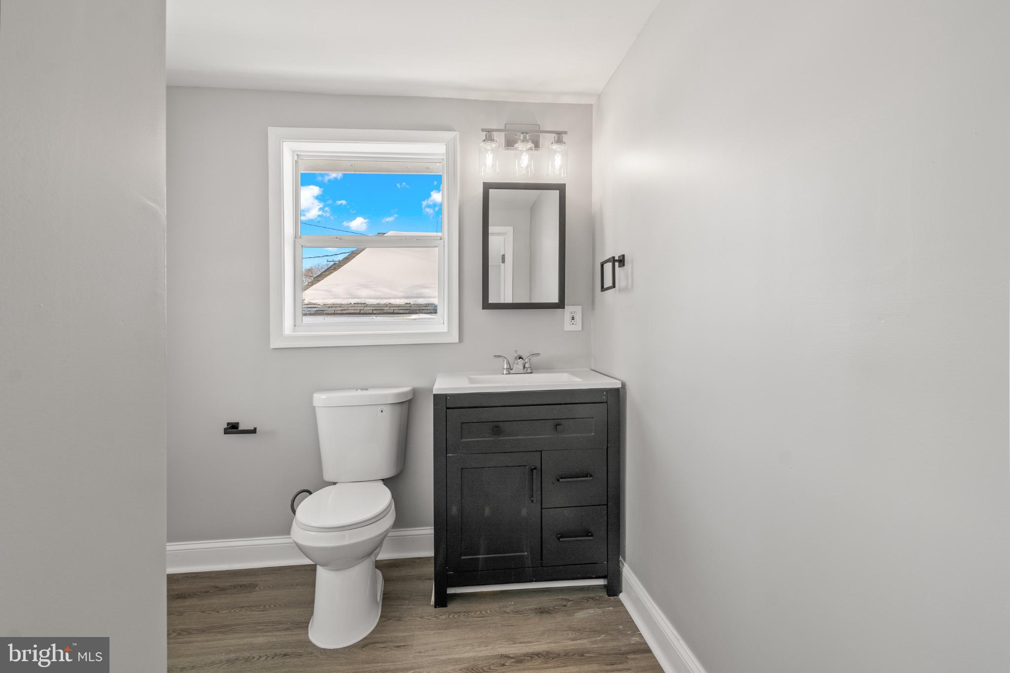 315 Riverside Drive Essex, MD 21221 - Photo 6 of 33 a bathroom with a toilet and a sink