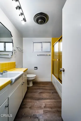 a bathroom with a sink a bathtub and a shower
