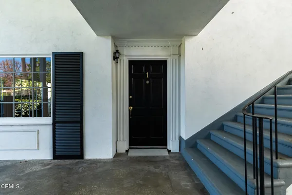 a view of entryway with wooden floor
