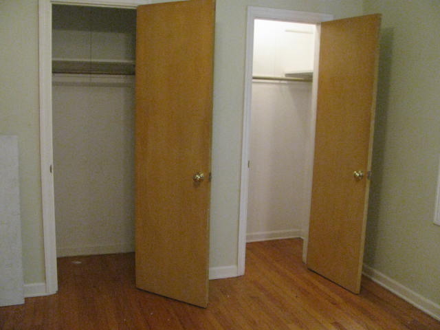18324 Perth Avenue Homewood, IL 60430 - Photo 13 of 17 a view of an empty room with wooden floor and closet