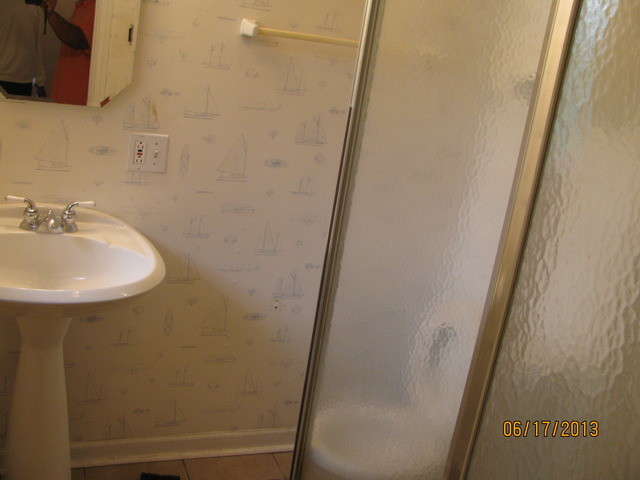 18324 Perth Avenue Homewood, IL 60430 - Photo 14 of 17 a bathroom with a sink and a mirror