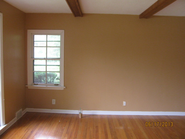 18324 Perth Avenue Homewood, IL 60430 - Photo 3 of 17 a view of an empty room with wooden floor and a window
