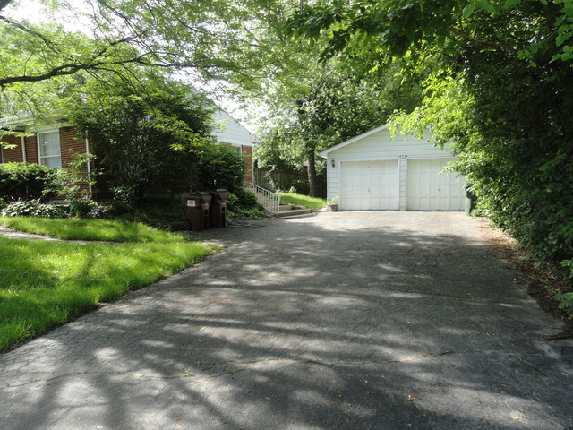 18324 Perth Avenue Homewood, IL 60430 - Photo 9 of 17 a front view of a house with yard and green space