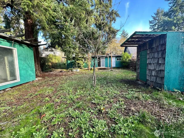 a backyard of a house with lots of green space