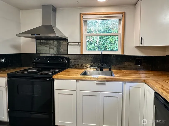a kitchen with a sink and a stove