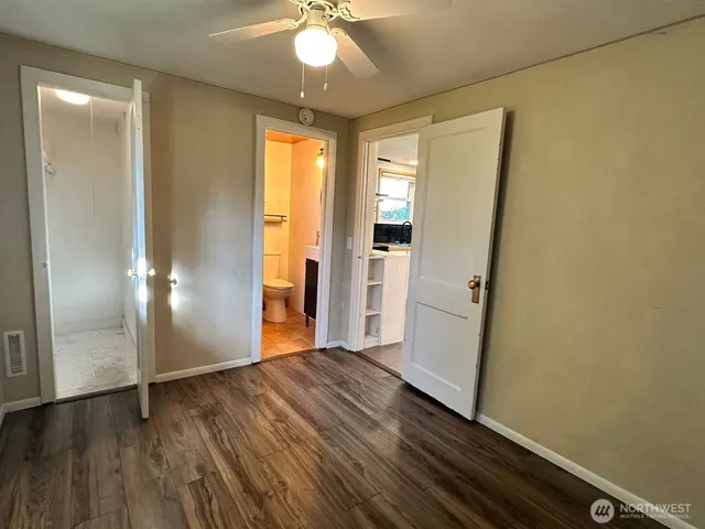 a view of a livingroom with wooden floor